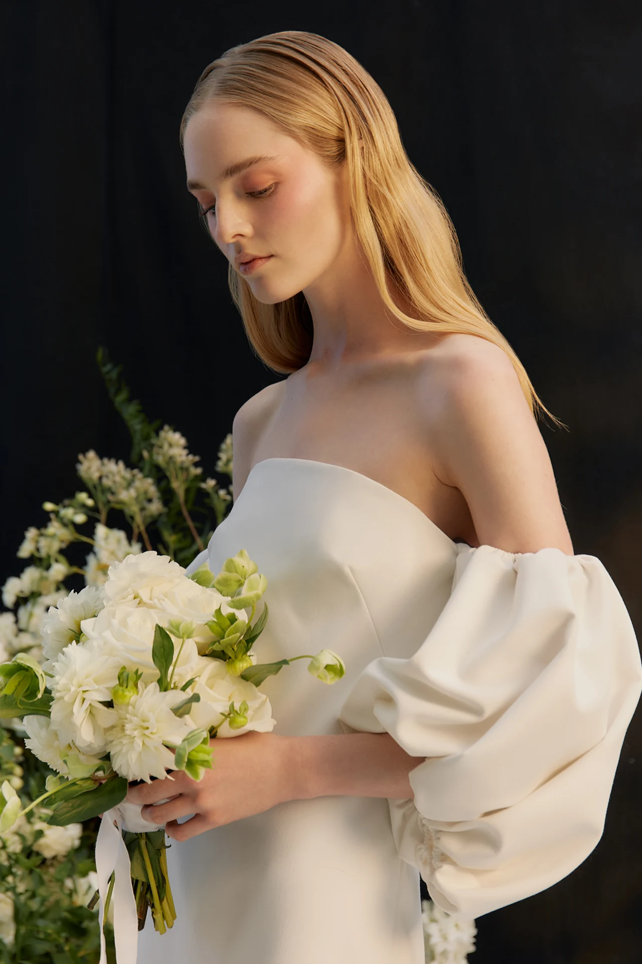 Bridal portrait with a white floral bouquet in soft light