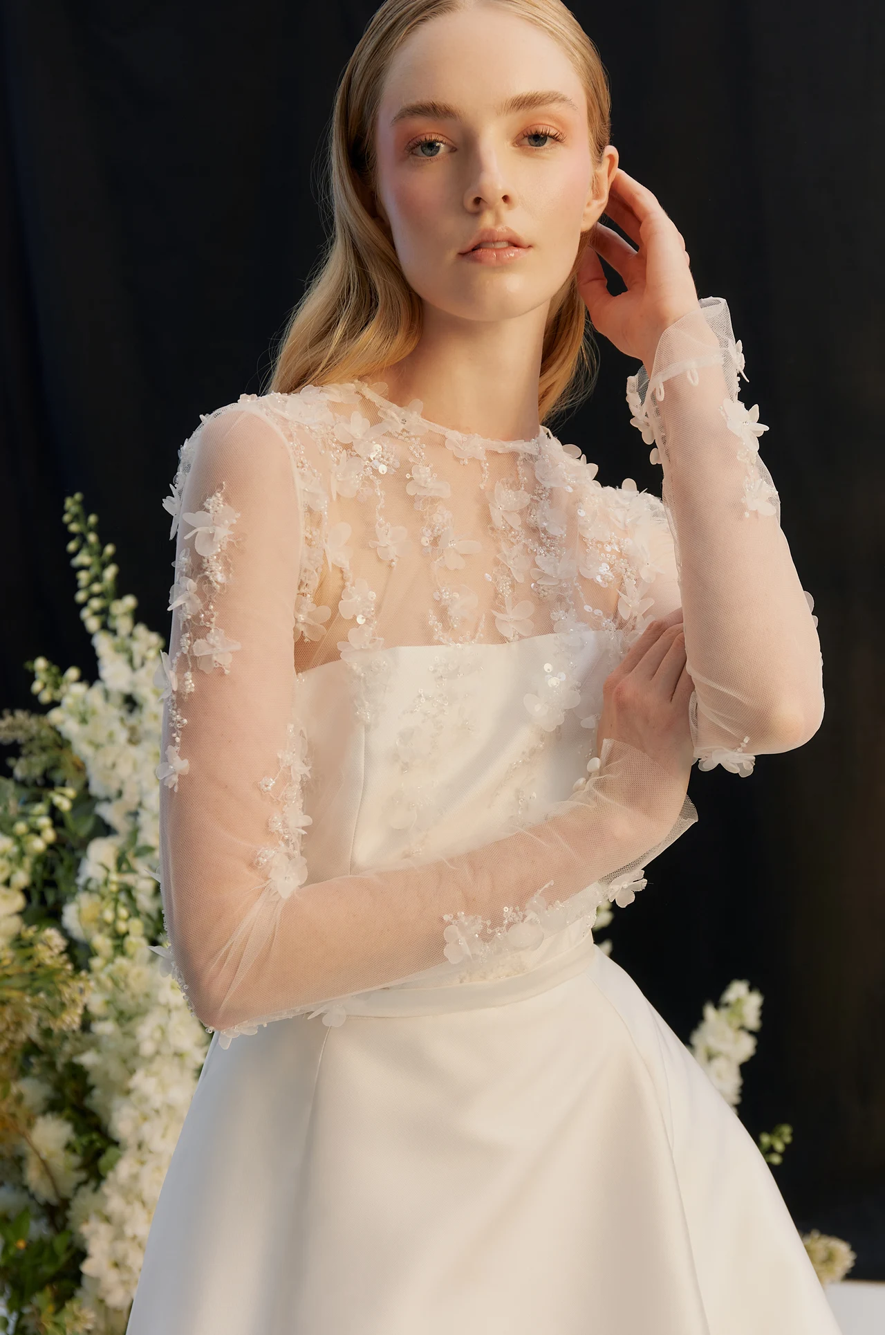 Bridal portrait with delicate lace and sheer sleeves