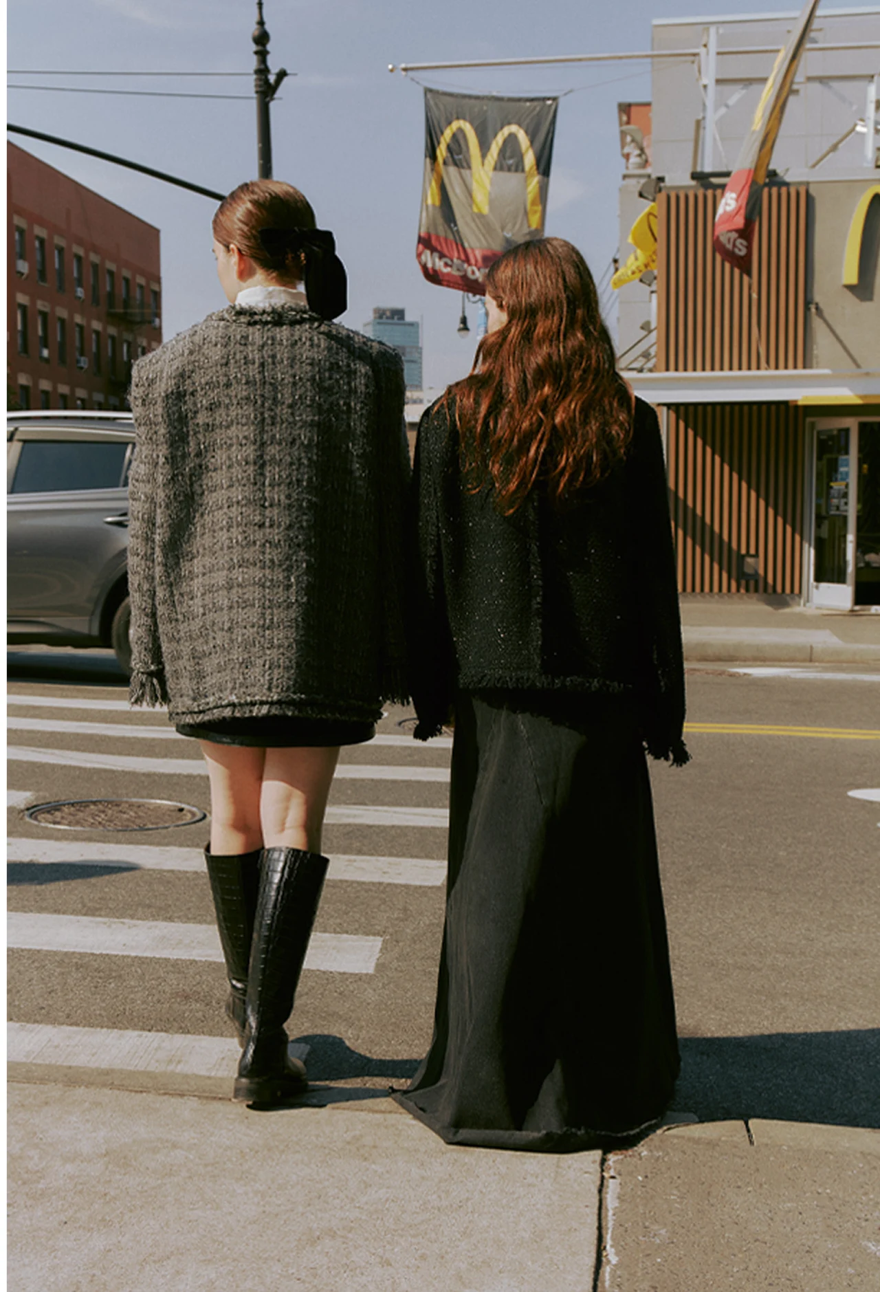 Two models wearing tailored clothing outdoors