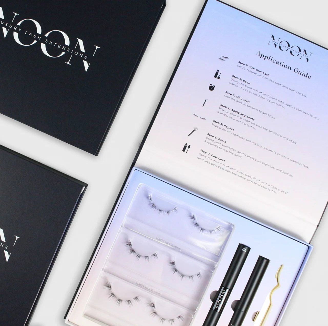 NOON LASH product box with eyelashes and beauty tools