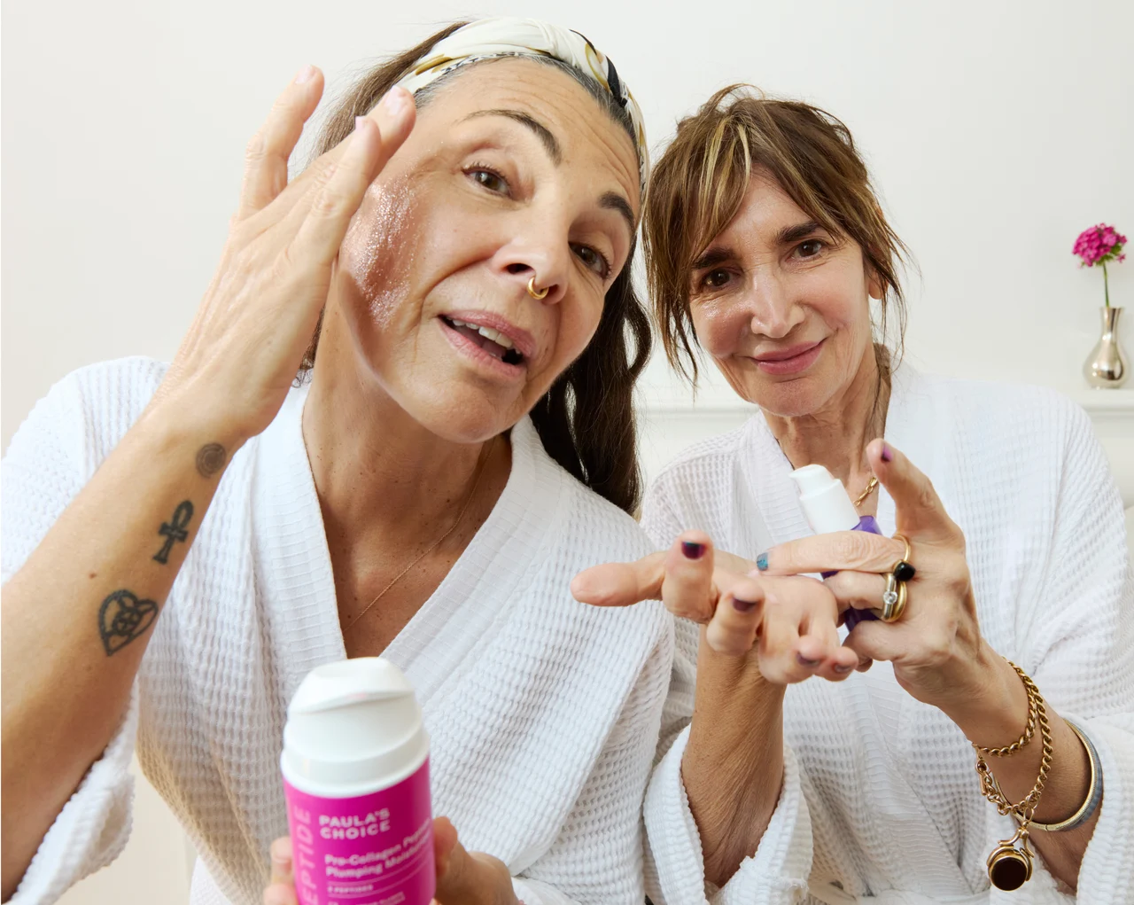 Two women with Paula’s Choice skincare in a bright bathroom